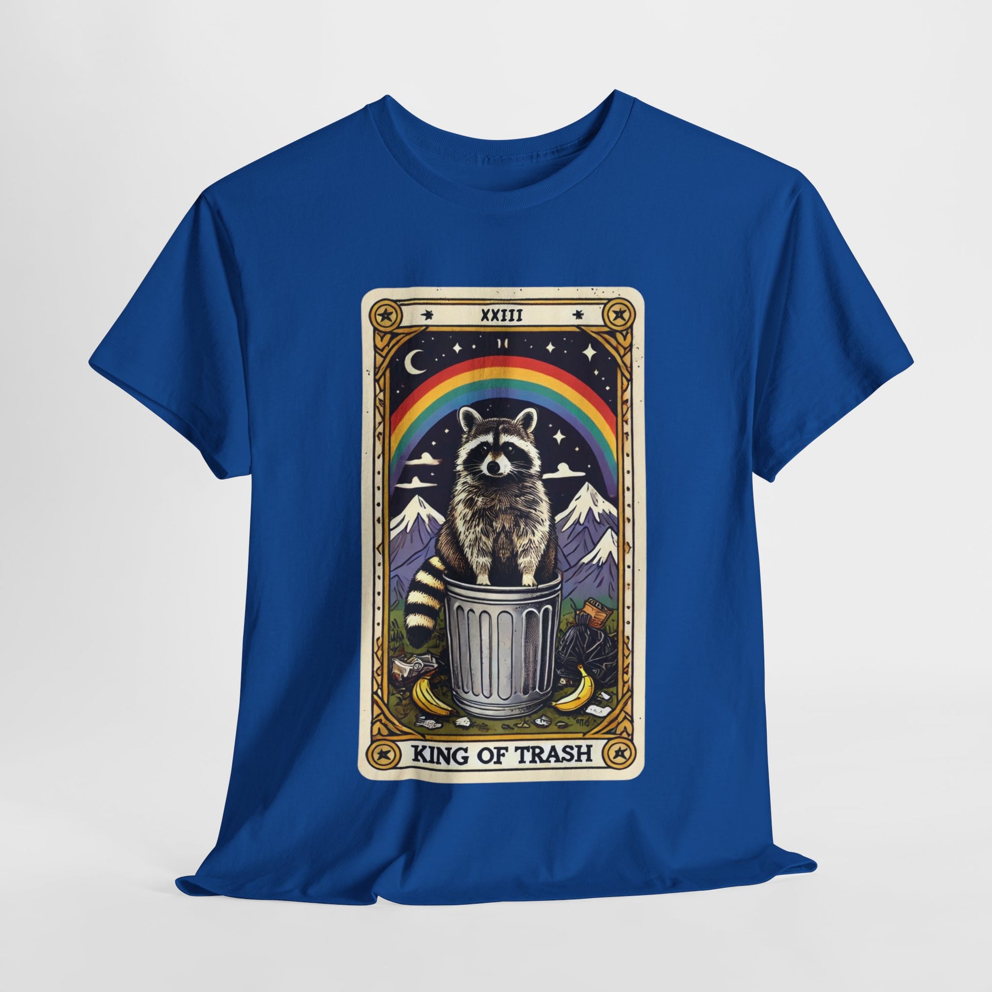 Royal blue t-shirt with a tarot card-style design featuring the king of trash tarot card that has a raccoon standing on a trash can under a rainbow. The card has a roman numeral on the top and "King Of Trash" written on the bottom of the card image.