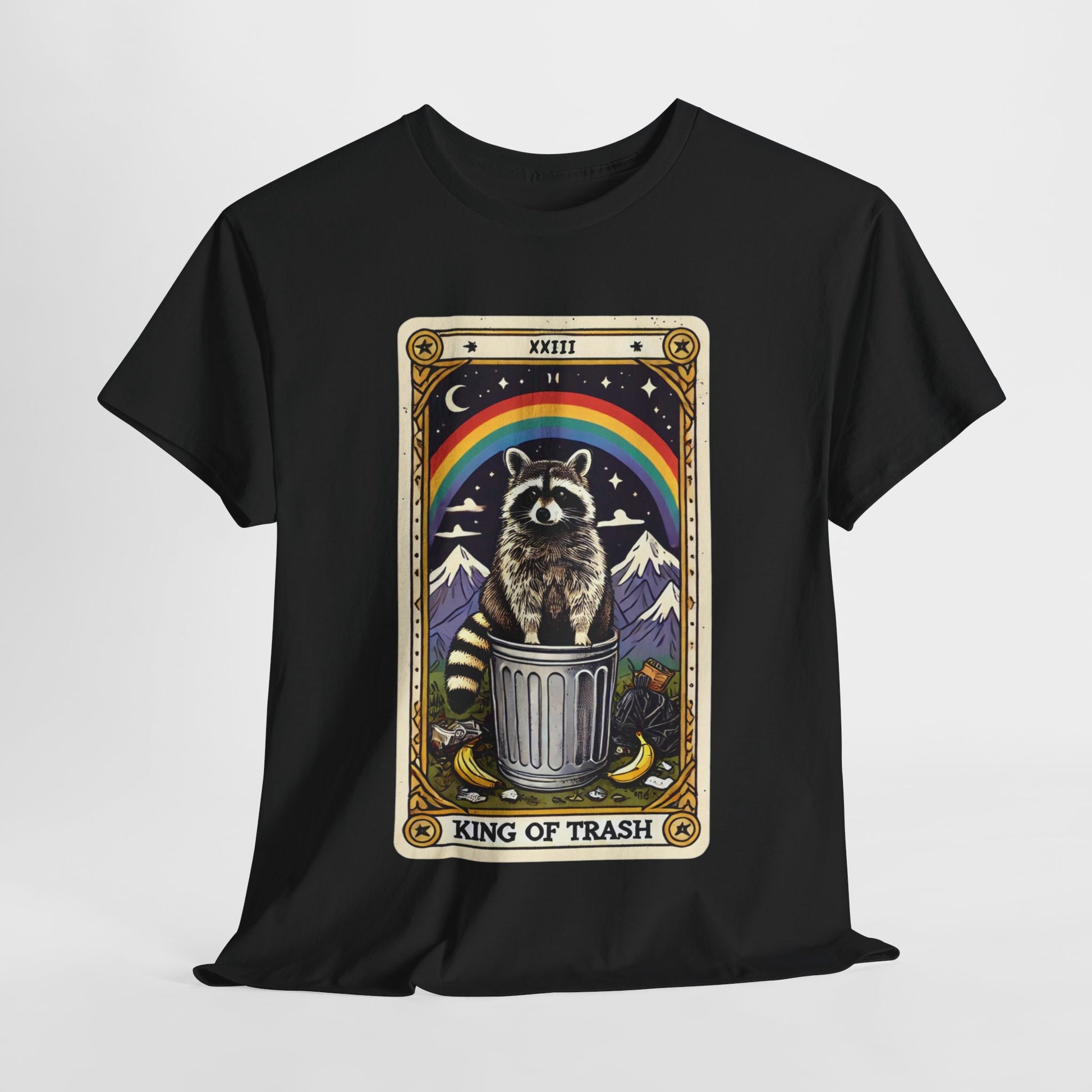 Black t-shirt with a tarot card-style design featuring the king of trash tarot card that has a raccoon standing on a trash can under a rainbow. The card has a roman numeral on the top and "King Of Trash" written on the bottom of the card image.